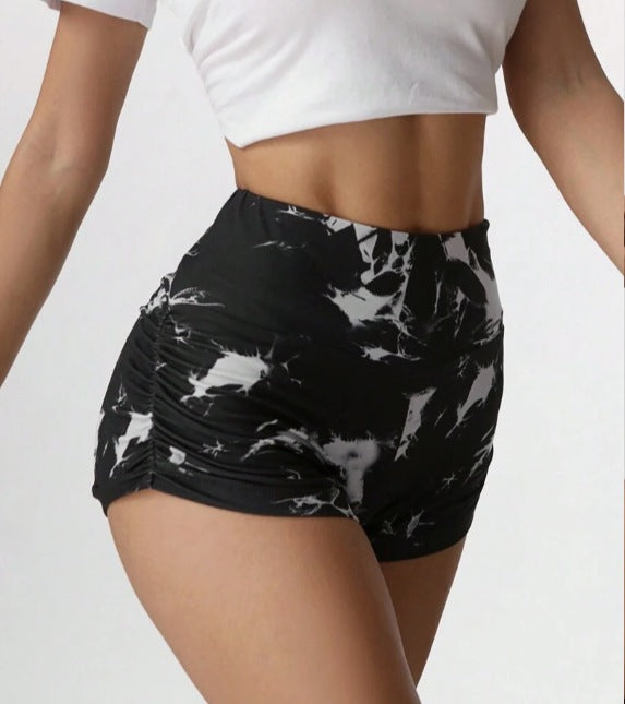 Black Halloween skull print cropped leggings with pleated design, ideal for active wear by Flip Styles.