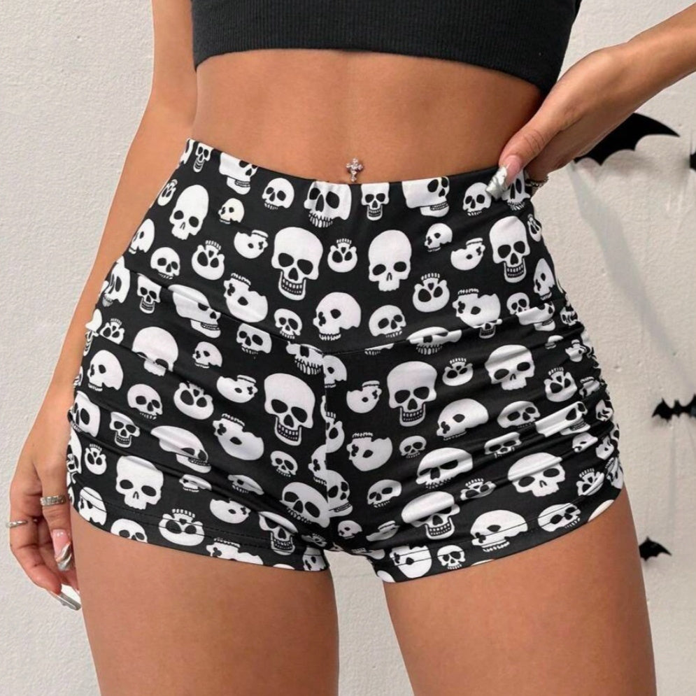 Black Halloween skull print cropped leggings from Flip Styles featuring pleated design, ideal for active wear and Halloween costumes.
