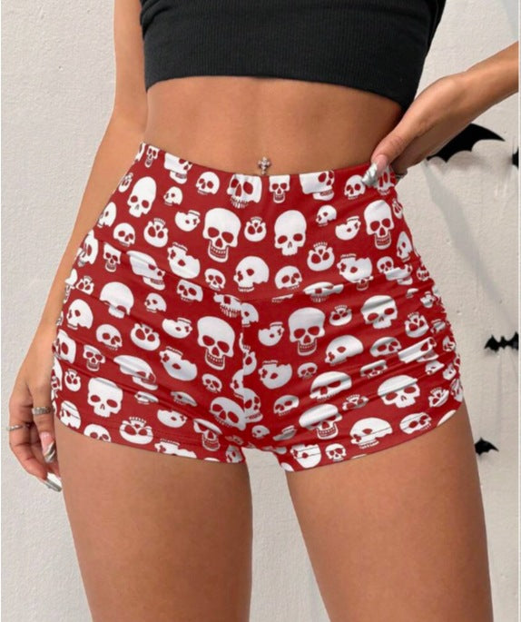 Black Halloween skull print cropped pleated leggings by Flip Styles, featuring a trendy activewear design with skull patterns.